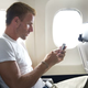 Illustration for article titled Disheartened Man Expected At Least One Text While Checking Phone After Flight
